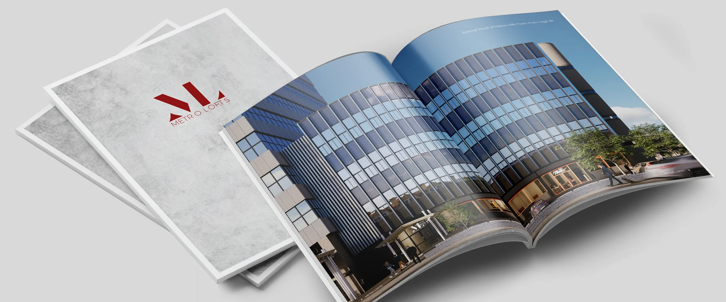 Metro Lofts brochure covers with the red ML monogram beside an open spread of the glass-fronted building