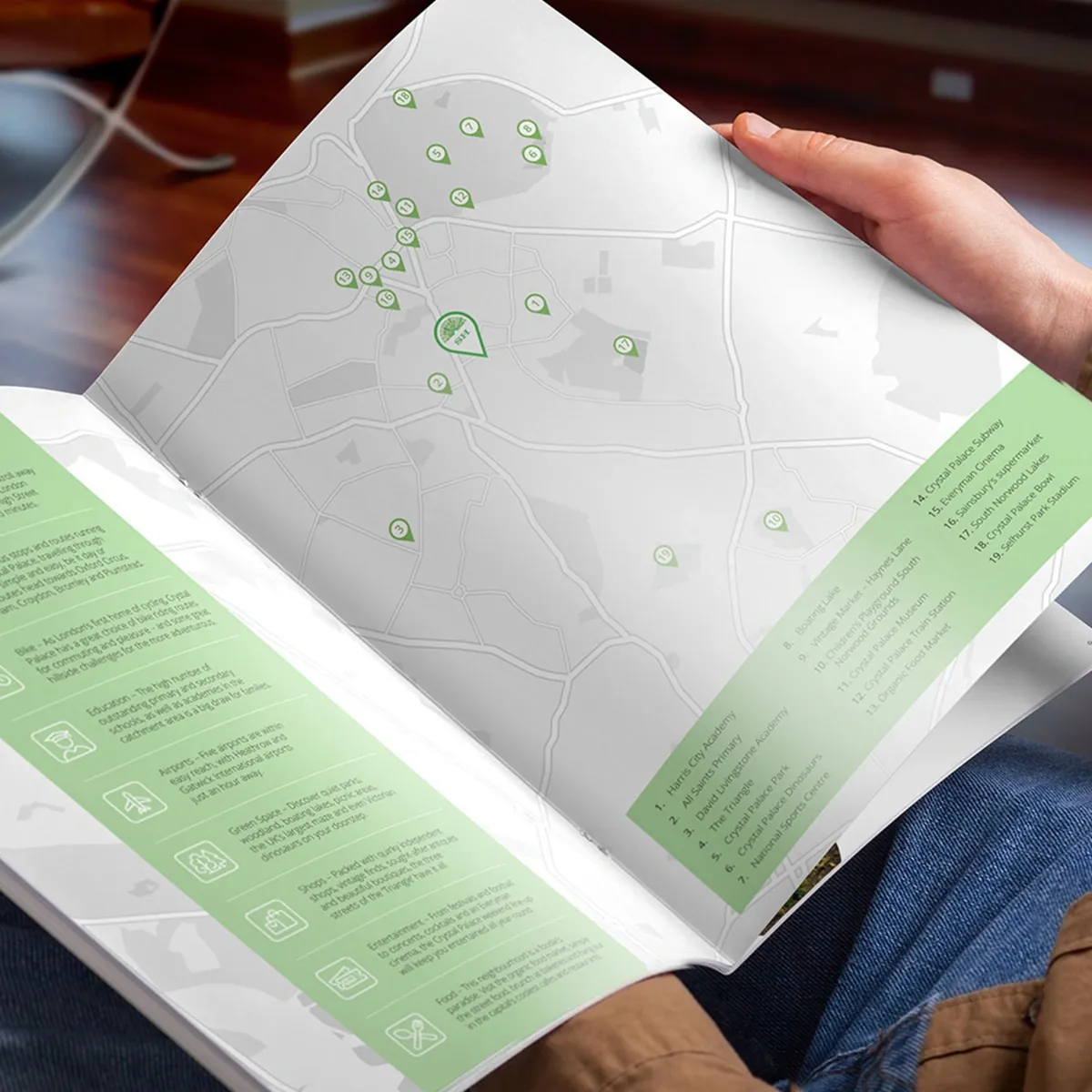Sylvan Hill brochure open at the location map spread, with numbered local amenities on a green panel